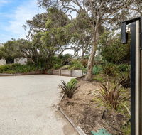 SeaSide Serenity tennis court  back beach
