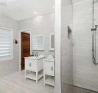 Bathers across the bay from Port Douglas - Accommodation Melbourne